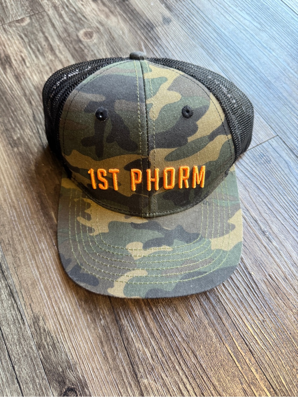 Camo Trucker Hat with Orange Embroidery